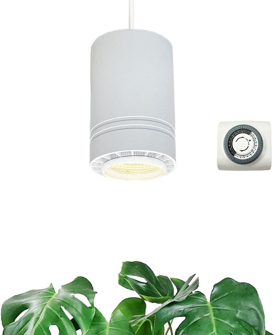 Soltech Aspect grow light pendant illuminating a collection of indoor plants