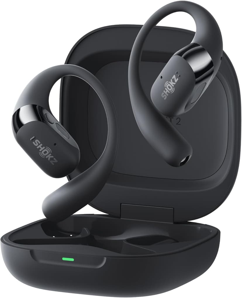 Shokz OpenFit 2+ earbuds with soft ear hooks on a training mat