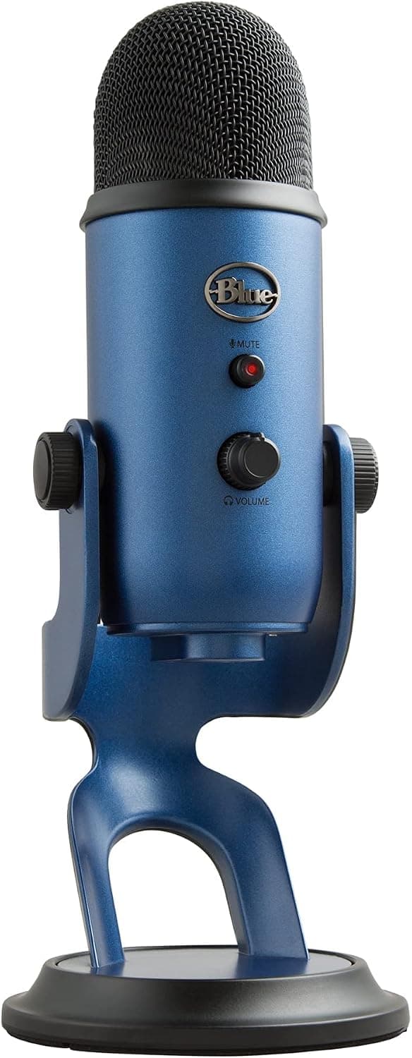 Blue Yeti X USB microphone on a desk with headphones