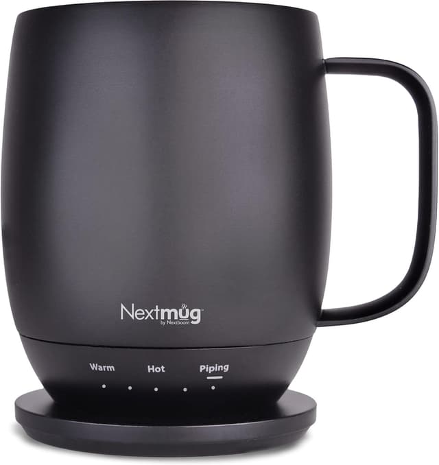 Nextmug temperature-controlled self-heating coffee mug on a minimalist kitchen counter