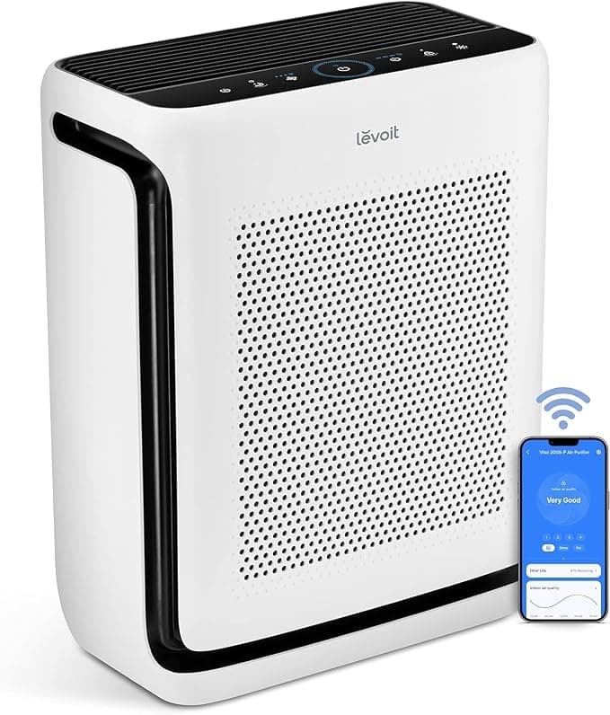 Levoit Vital 200S-P air purifier in a white bedroom with plants