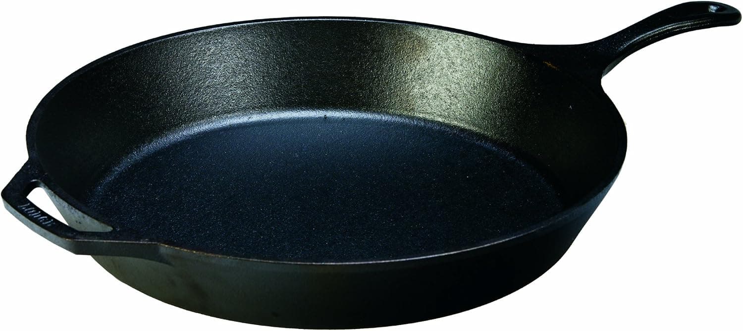 Lodge 15 inch cast iron skillet with signature teardrop handle on a stove top