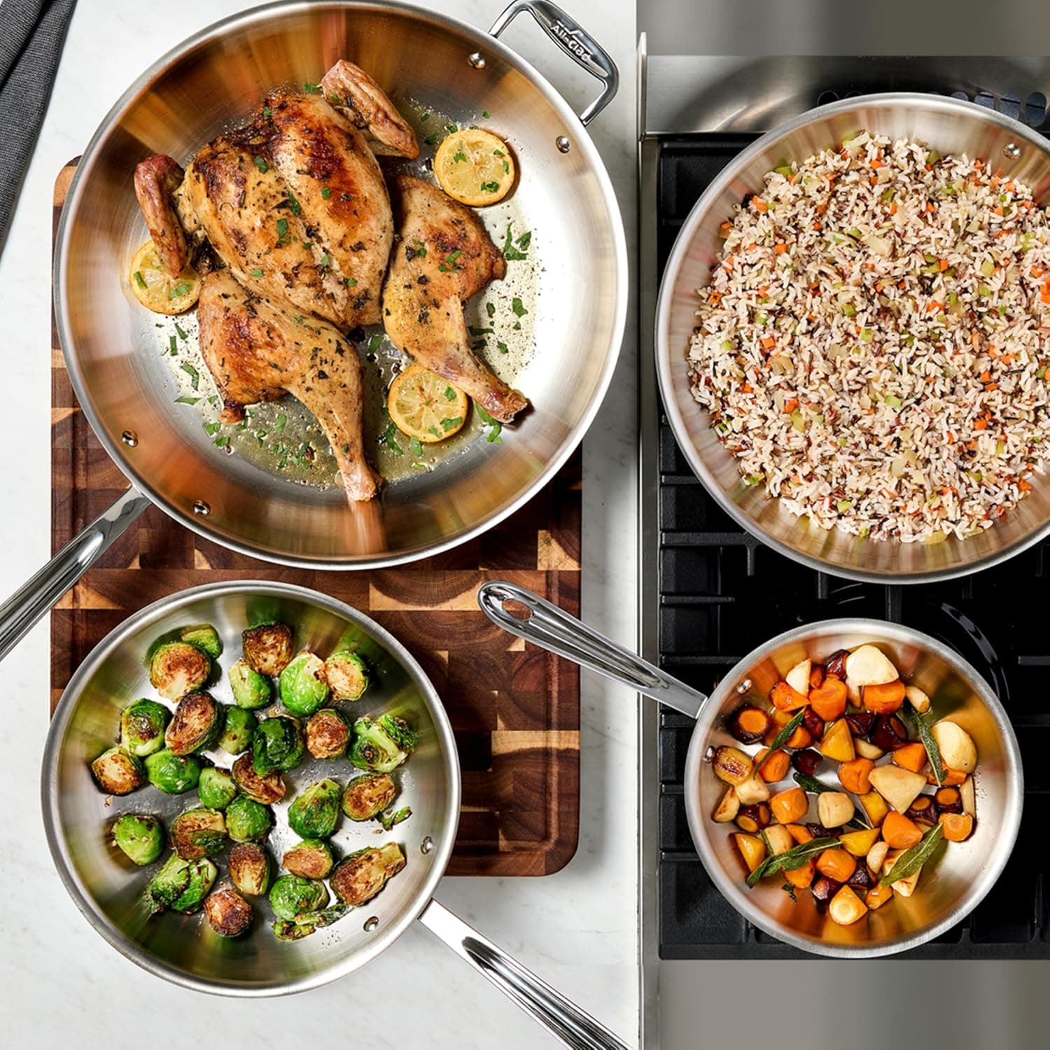 All-Clad D3 12-inch stainless steel frying pan with lid on stovetop