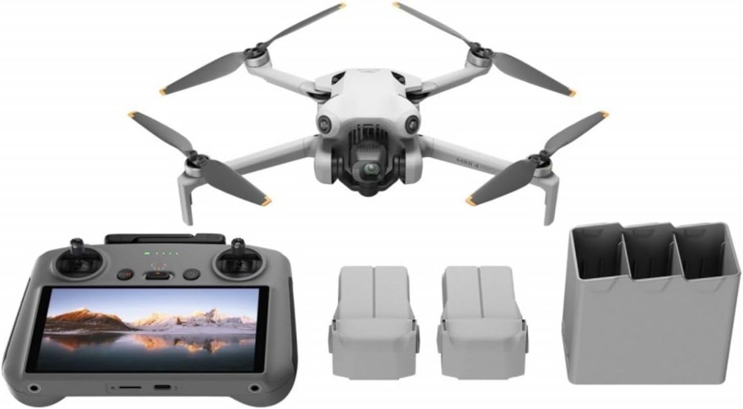 DJI Mini 4 Pro Fly More Combo Plus with RC 2 remote and batteries arranged on table