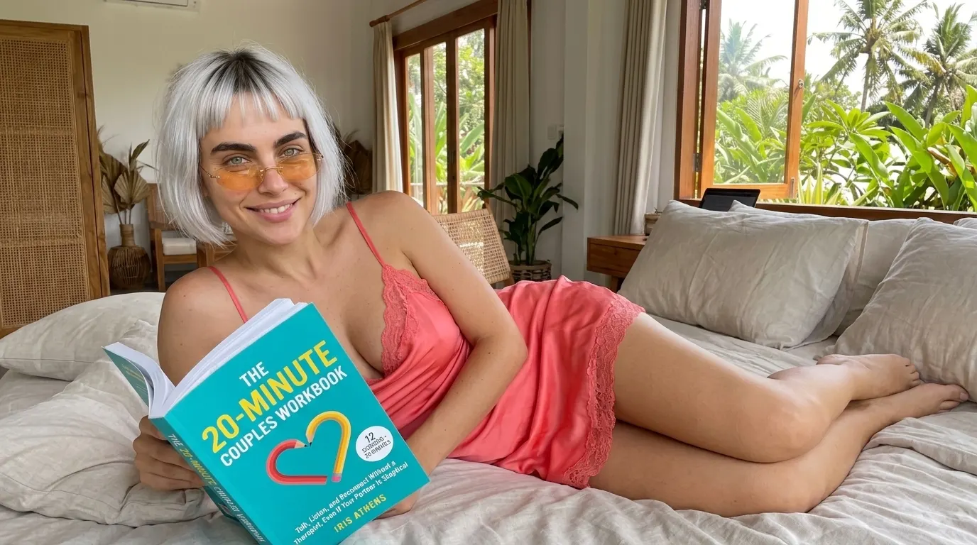 Woman lying down with The 20-Minute Couples Workbook on a bed