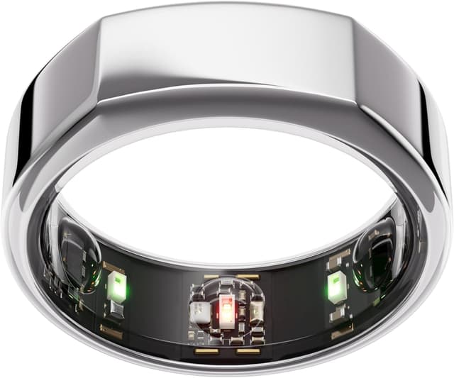 Oura Ring Gen3 on a nightstand with sleep journal