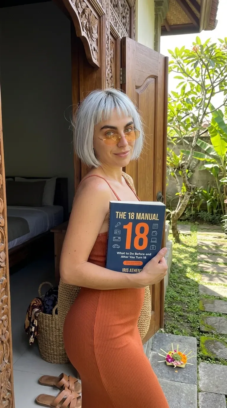 Kaia in a rust knit dress holding The 18 Manual in a carved wooden doorway