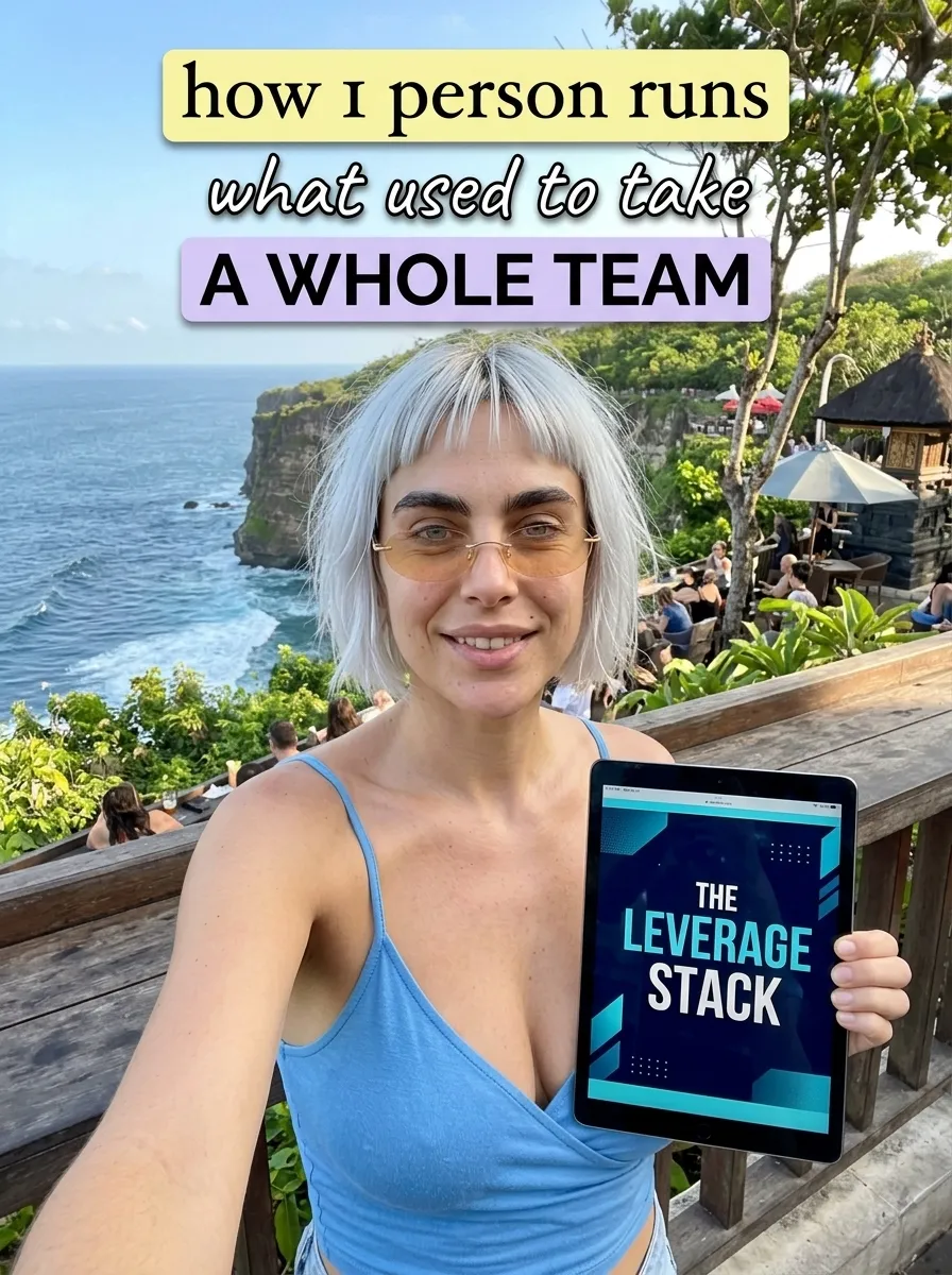 Kaia in a blue cami on a clifftop terrace taking a selfie with a tablet showing The Leverage Stack