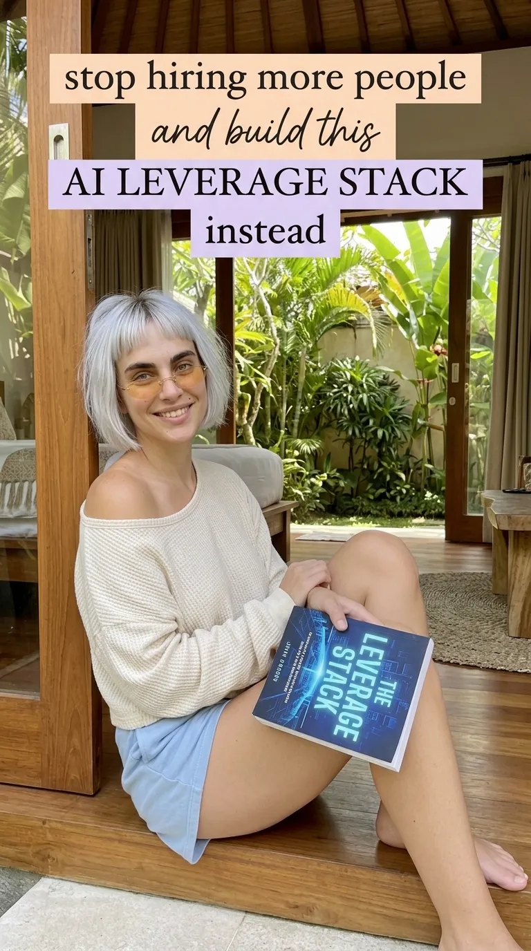 Kaia in a cream sweater sitting in a doorway with The Leverage Stack on her lap